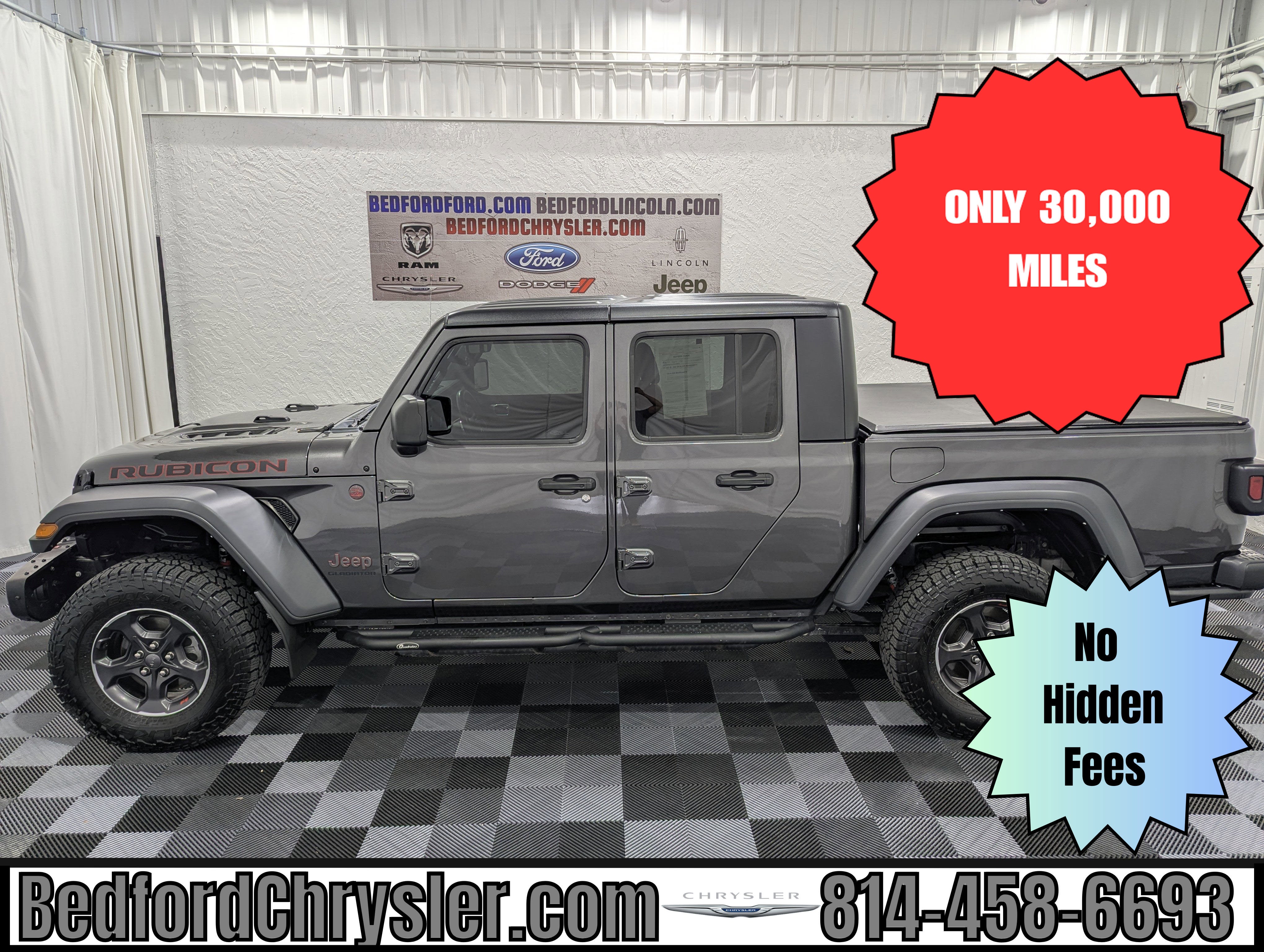 2022 Jeep Gladiator Rubicon 4x4 in Granite Crystal Metallic Clearcoat — front three-quarter view
