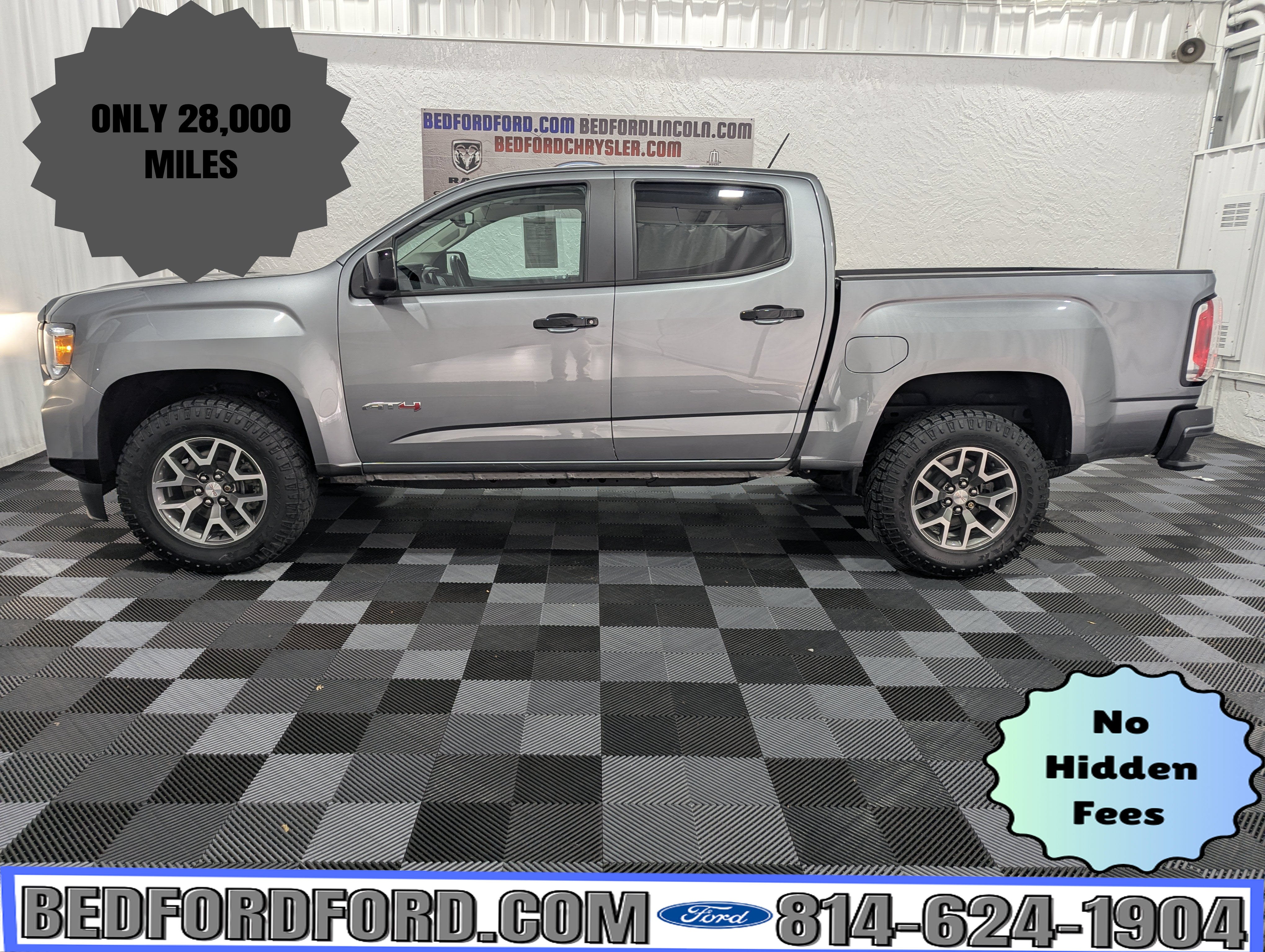 2022 GMC Canyon 4WD AT4 w/Leather in Satin Steel Metallic — front three-quarter view